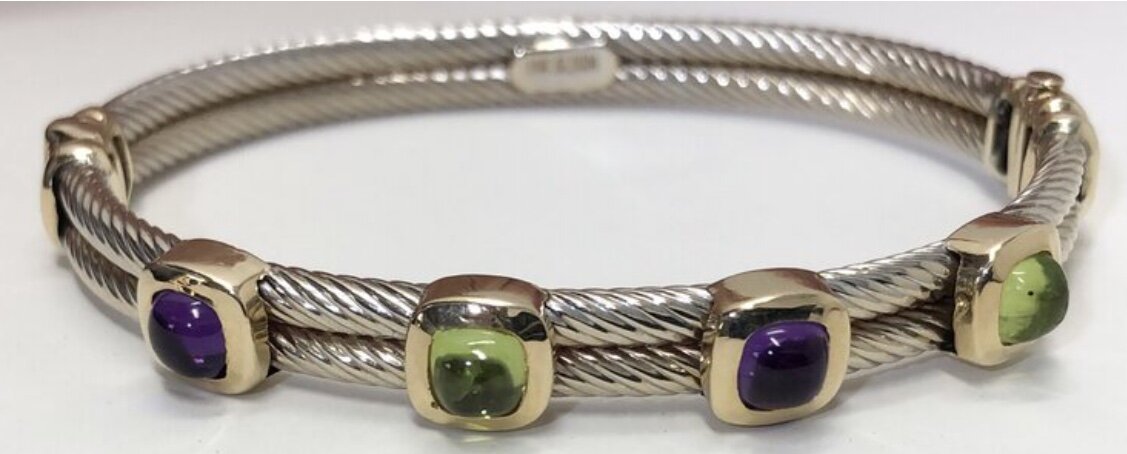 Contemporary/Designer Jewelry14K Two Tone Gold Peridot and Amethyst Bracelet. 1.7 carats of fine amethyst and 1.7 carats of fine peridot $1,495In the style of David Yurman, but this bracelet is solid 14k gold.